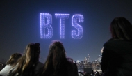 Drones illuminate the night sky with BTS logo during a drone light show at a riverside park in Seoul on March 20, 2026, ahead of the comeback concert of K-pop boy band BTS. Photo by Jung Yeon-je / AFP