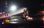 An Air Canada Express plane sits on the tarmac after it collided with a fire truck on the tarmac at LaGuardia Airport on March 23, 2026 in New York City. The plane had landed from a flight from Montreal. Spencer Platt/Getty Images/AFP 