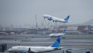 A United Airlines passenger plane takes off at Newark International Airport in Newark, New Jersey, on March 23, 2026. Photo by KENA BETANCUR / AFP
