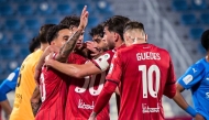 Al Rayyan players celebrate a goal against Al Shahania. 