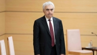 Executive Director of the International Energy Agency (IEA) Fatih Birol waits for Japan's Prime Minister Sanae Takaichi (not pictured) before their meeting at the beginning of their meeting at the Prime Minister's Office in Tokyo on March 25, 2026. (Photo by Yuichi YAMAZAKI / POOL / AFP)
