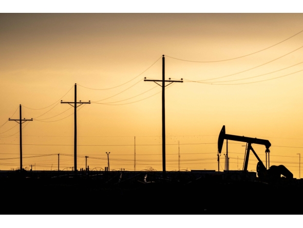 A pump jack is seen at sunset in Midland, Texas, US.