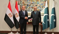 This handout photograph taken and released by Pakistan's Ministry of Foreign Affairs on March 29, 2026 shows Pakistan's Foreign Minister Ishaq Dar (R) shaking hand with his Egyptian counterpart Badr Abdelatty at Foreign Ministry office in Islamabad. (Photo by Handout / Pakistan's Ministry of Foreign Affairs / AFP) 