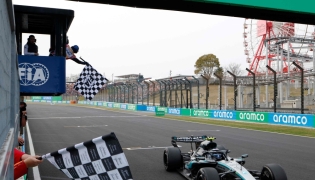 Mercedes' Italian driver Kimi Antonelli crosses the finish line to win the Formula One Japanese Grand Prix at the Suzuka circuit in Suzuka, Mie prefecture on March 29, 2026. (Photo by Franck Robichon / Pool / AFP)