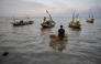 A man prepares to go fishing in Surabaya on March 30, 2026. (Photo by JUNI KRISWANTO / AFP)