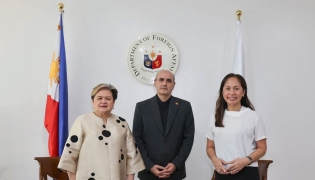 In this handout photo taken April 1, 2026 and released by the Philippine Department of Foreign Affairs shows Philippine Secretary of Foreign Affairs Thereza Lazaro (L), Iranian Ambassador to the Philippines Yousef Esmaeilzadeh (C) and Philippine Secretary of Energy Sharon Garin posing for a photo during a bilateral meeting in Manila. (Photo by Handout / Philippine Department of Foreign Affairs / AFP) 