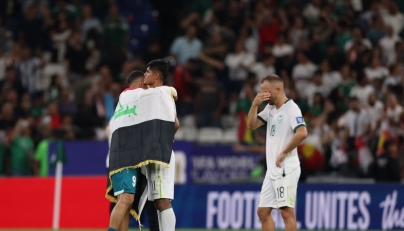 Iraq's forward #09 Ali Al-Hamadi (L) comforts Bolivia's forward #11 Fernando Nava (C) after the 2026 FIFA World Cup qualifiers final playoff football match between Iraq and Bolivia at the BBVA Stadium in Guadalupe, Nuevo Leon state, Mexico (Photo by Julio Cesar Aguilar / AFP)