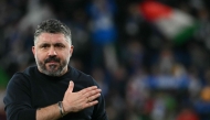 (FILES) Italy's headcoach Gennaro Gattuso greets supporters after winning the play-off FIFA World Cup 2026 European qualification semi-final football match between Italy and North Ireland at the Gewiss stadium in Bergamo, on March 26, 2026. (Photo by Alberto PIZZOLI / AFP)