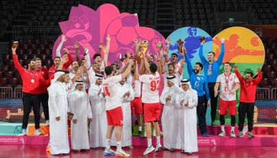 Second Vice President of the Qatar Olympic Committee Dr. Thani bin Abdulrahman Al-Kuwari, and Qatar Handball Federation President Ahmed Mohammed Al-Shaabi applaud as Al Arabi players celebrate their triumph.
