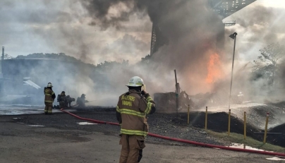 This handout picture released by the Panama Firefighting Department press office shows Panamanian firefighters tackling a blaze caused by the explosion of a fuel tanker under the Bridge of the Americas, at the Pacific entrance to the Panama Canal, in Panama City on April 6, 2026. (Photo by Handout / Panama Firefighting Department / AFP) 