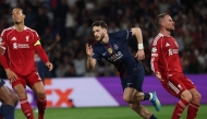 Paris Saint-Germain's Georgian forward #07 Khvicha Kvaratskhelia celebrates scoring his team's second goal during the UEFA Champions League quarter-final first leg football match between Paris Saint-Germain (PSG) and Liverpool FC at the Parc des Princes stadium in Paris on April 8, 2026. (Photo by Anne-Christine POUJOULAT / AFP)