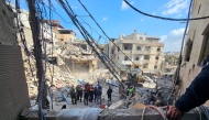 Workers clear rubble from the site of an Israeli airstrike the day before that targeted the Bir Hassan neighbourhood in Beirut's southern suburbs on April 9, 2026. (Photo by AFP)