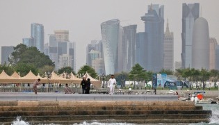 People visit the Corniche area of Doha on a cloudy day on April 9, 2026. (Photo by AFP)
