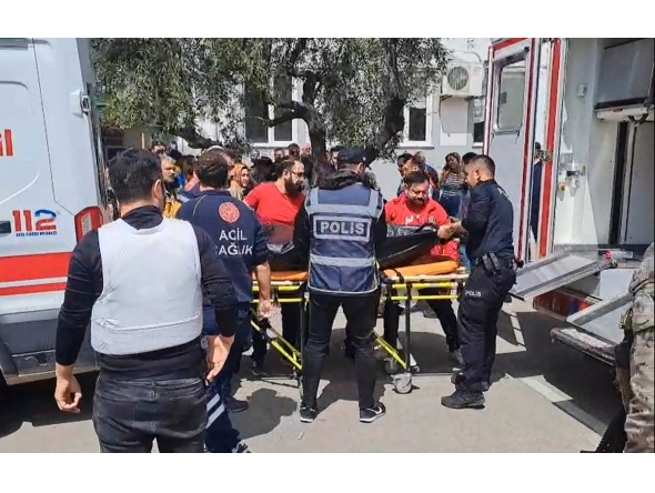This handout photograph taken and released on April 15, 2026 by Turkish news agency DHA (Demiroren News Agency) shows first aid officers carrying a body bag in Kahramanmaras, southern Turkiye. Photo by HANDOUT / DHA (Demiroren News Agency) / AFP