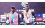 Qatar's Cherif Younousse (right) and Ahmed Tijan pose with their trophies.