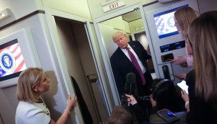 US President Donald Trump speaks to members of the press aboard Air Force One on April 17, 2026 just prior to landing at Joint Base Andrews, Maryland. Win McNamee/Getty Images/AFP