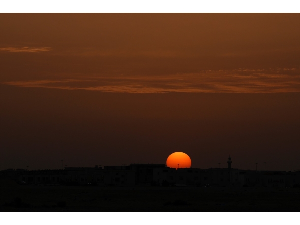 The sun sets over the city of Doha on April 17, 2026. (Photo by AFP)
