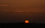 The sun sets over the city of Doha on April 17, 2026. (Photo by AFP)
