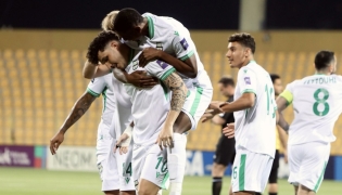 Al Ahli players celebrate during the quarter-final against Al Hussein on Sunday.