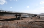 This handout image released by the Russian Transport Ministry on April 21, 2026, shows the under construction road bridge over the Tumen River connecting Russia and North Korea, set to open this summer. (Photo by Handout / Russian Transport Ministry / AFP) 