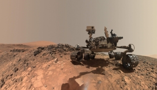 (Files) This NASA photo released June 7, 2018, shows a low-angle self-portrait of NASA's Curiosity Mars rover vehicle at the site from which it reached down to drill into a rock target called 