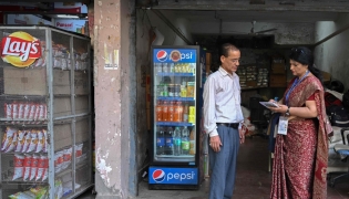 Sukhwinder Kaur (R), a census enumerator and a school teacher, collects details of housing and amenities during a door-to-door survey in the first phase of the census at a residential area in New Delhi on April 20, 2026. (Photo by Arun Sankar / AFP)