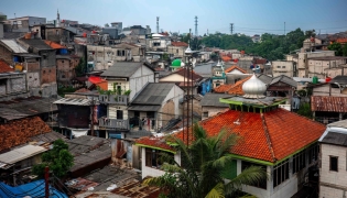 Houses are seen in a densely populated neighbourhood in Jakarta on April 21, 2026. (Photo by BAY ISMOYO / AFP)