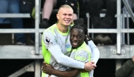Manchester City's Norwegian striker #09 Erling Haaland (L) celebrates scoring the team's first goal during the English Premier League football match between Burnley and Manchester City at Turf Moor in Burnley, north-west England on April 22, 2026. (Photo by Paul ELLIS / AFP)