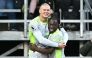 Manchester City's Norwegian striker #09 Erling Haaland (L) celebrates scoring the team's first goal during the English Premier League football match between Burnley and Manchester City at Turf Moor in Burnley, north-west England on April 22, 2026. (Photo by Paul ELLIS / AFP)