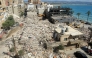 Diggers remove the rubble of buildings destroyed in Israeli strikes as they look for survivors buried underneath in the southern Lebanese coastal city of Tyre on April 21, 2026. Photo by Mahmoud Zayyat / AFP