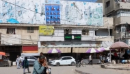 A poster of electoral candidates in Deir el-Balah in Gaza. Photo by Haseeb Alwazeer/Reuters