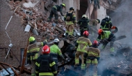 UKRAINE-RUSSIA-CONFLICT-WAR
This handout photograph taken and released by the State Emergency Service of Ukraine on April 25, 2026 shows Ukrainian rescuers clearing debris in a residential building following a Russian attack in Dnipro, amid the Russian invasion of Ukraine.
 (Photo by Handout / State Emergency Service of Ukraine / AFP) / RESTRICTED TO EDITORIAL USE - MANDATORY CREDIT 