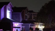 FBI tactical agents leave a house associated with the suspected White House Correspondents’ Dinner shooter after making entry at the residence in Torrance, California, late on April 25, 2026. Photo by Patrick T. Fallon / AFP