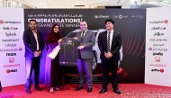 The winner with the officials during the key handover ceremony. Pic: Salim Matramkot