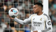 Real Madrid's French forward #10 Kylian Mbappe handles the ball during the Spanish league football match between Real Betis and Real Madrid CF at the La Cartuja stadium in Seville on April 24 , 2026. (Photo by CRISTINA QUICLER / AFP)

