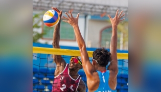 Qatar’s Ahmed Tijan (left) in action during the beach volleyball quarter-final against China. 