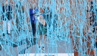 Ukraine's Marta Kostyuk celebrates on the podium after beating Russia's Mirra Andreeva during the 2026 WTA Tour Madrid Open tennis tournament final singles match at the Caja Magica in Madrid, on May 2, 2026. (Photo by Thomas COEX / AFP)