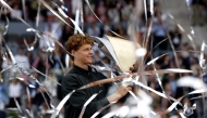 Italy's Jannik Sinner celebrates with his trophy after winning the 2026 ATP Tour Madrid Open tennis tournament final singles match against Germany's Alexander Zverev at the Caja Magica in Madrid, on May 3, 2026. (Photo by Oscar DEL POZO / AFP)
