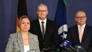 Australia's Attorney-General Michelle Rowland (L) speaks on the Royal Commission on last year's antisemitic attack where two gunmen killed 15 Jews at Australia's Bondi Beach, while Prime Minister Anthony Albanese (R) and Home Affairs Minister Tony Burke look on during a press conference in Sydney on April 30, 2026. (Saeed KHAN / AFP)