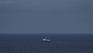 This general view shows the cruise ship MV Hondius, leaving the port of Praia, the capital of Cape Verde, on May 6, 2026. (Photo by AFP)