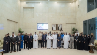 President of UDST Dr. Salem Al-Naemi with other officials receiving the certification. 