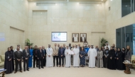 President of UDST Dr. Salem Al-Naemi with other officials receiving the certification. 