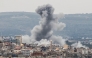  A photograph taken from the southern area of Tyre shows smoke rising from the site of an Israeli airstrike that targeted the area of Ras Al-Ain on May 12, 2026. (Photo by KAWNAT HAJU / AFP)