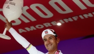 UAE Team Emirates - XRG Ecuadorian rider Jhonatan Narvaez celebrates on the podium after winning the 8th stage of the Giro d'Italia 2026. (Photo by Luca Bettini / AFP)

