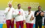 Qatar's Angelo Scalzoni, Mohammed Al Rumaihi and Saeed Abu Shareb celebrate with their gold medals.