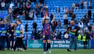 Barcelona's Spanish midfielder #14 Aitana Bonmati holds the Women's Champions League Trophy following the victory ceremony after FC Barcelona won the UEFA Women's Champions League final football match between FC Barcelona and Olympique Lyonnais (OL) at the Ullevaal Stadium in Oslo, Norway on May 23, 2026. 
(Photo by Jonathan Nackstrand / AFP)