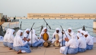 Performers reenacting the seafaring tradition during the Eid Al Adha celebrations at the Old Doha Port yesterday. PIC: Mohammed Al Attar / The Peninsula
