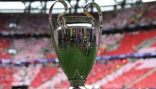 The trophy is displayed on the pitch prior to the UEFA Champions League final football match between Paris Saint-Germain (PSG) and Arsenal FC at the Puskas Arena in Budapest on May 30, 2026. (Photo by FRANCK FIFE / AFP)