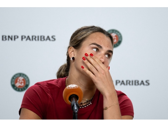 Aryna Sabalenka reacts during a press conference after being defeated by Diana Shnaider during their women's quarter final singles match on day 11 of the French Open tennis tournament on Court Philippe-Chatrier at the Roland-Garros Complex in Paris on June 3, 2026. (Photo by Sébastien DUPUY / AFP)
