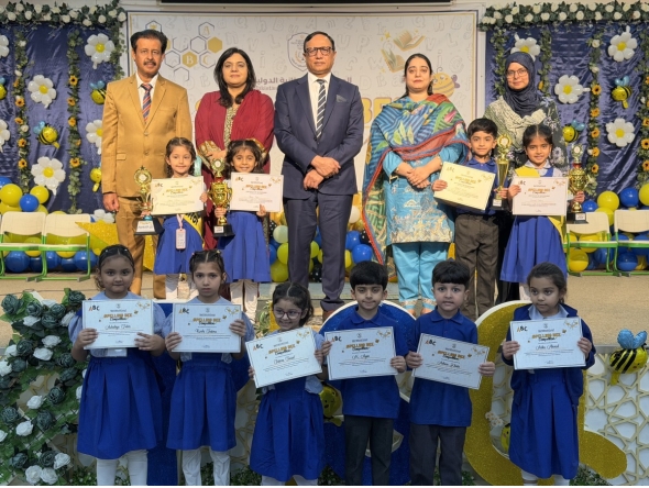 Principal PISQ Ch. Muhammad Afzal with officials and students during the event.